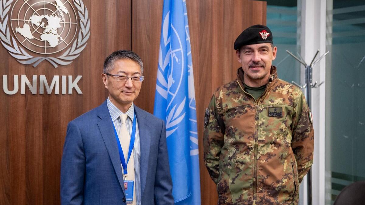 UNMIK Deputy Special Representative of the Secretary-General and Officer in Charge Milbert Dongjoon Shin standing beside the incoming Deputy Commander of KFOR, Brigadier General Federico Collina, at UNMIK Headquarters.
