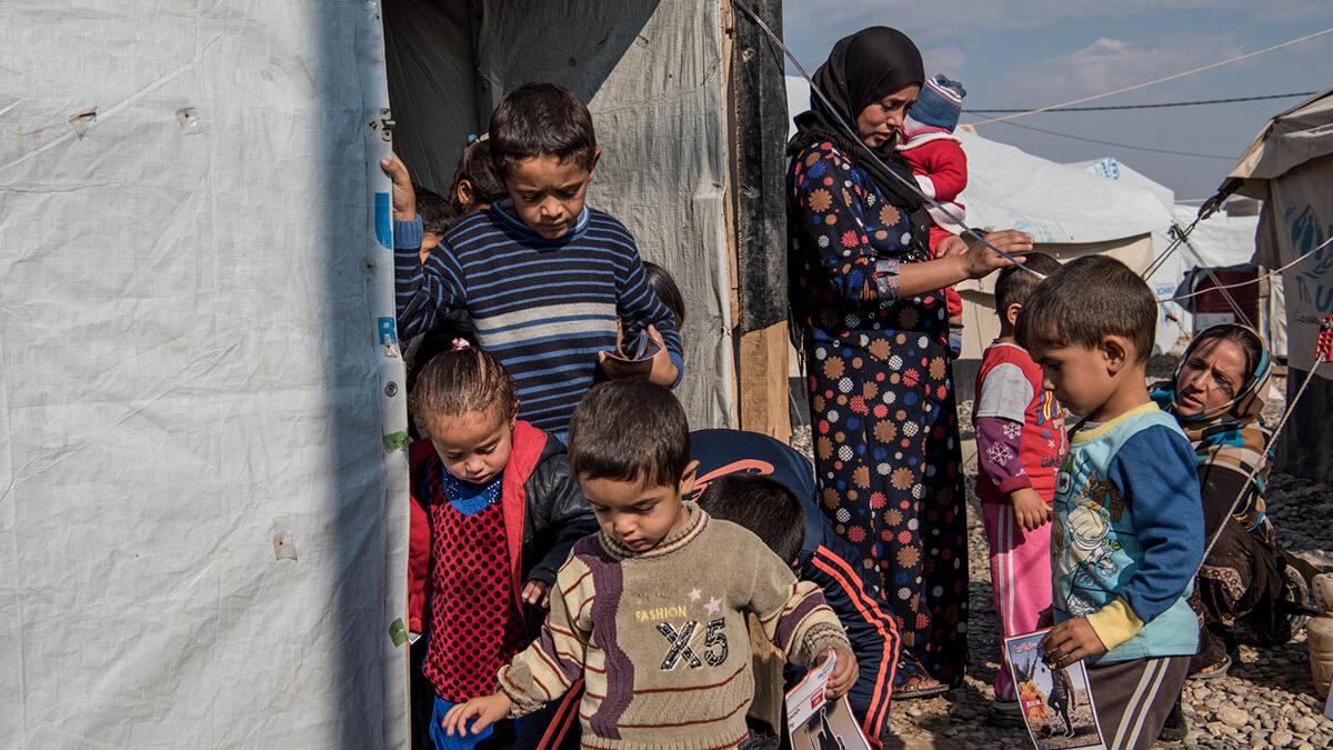 Delivering risk education to refugees and those internally displaced is an essential step to ensure their safe return to their cities and communities. Children leaving a risk education session in Salamiyah IDP camp south east of Mosul, Iraq.