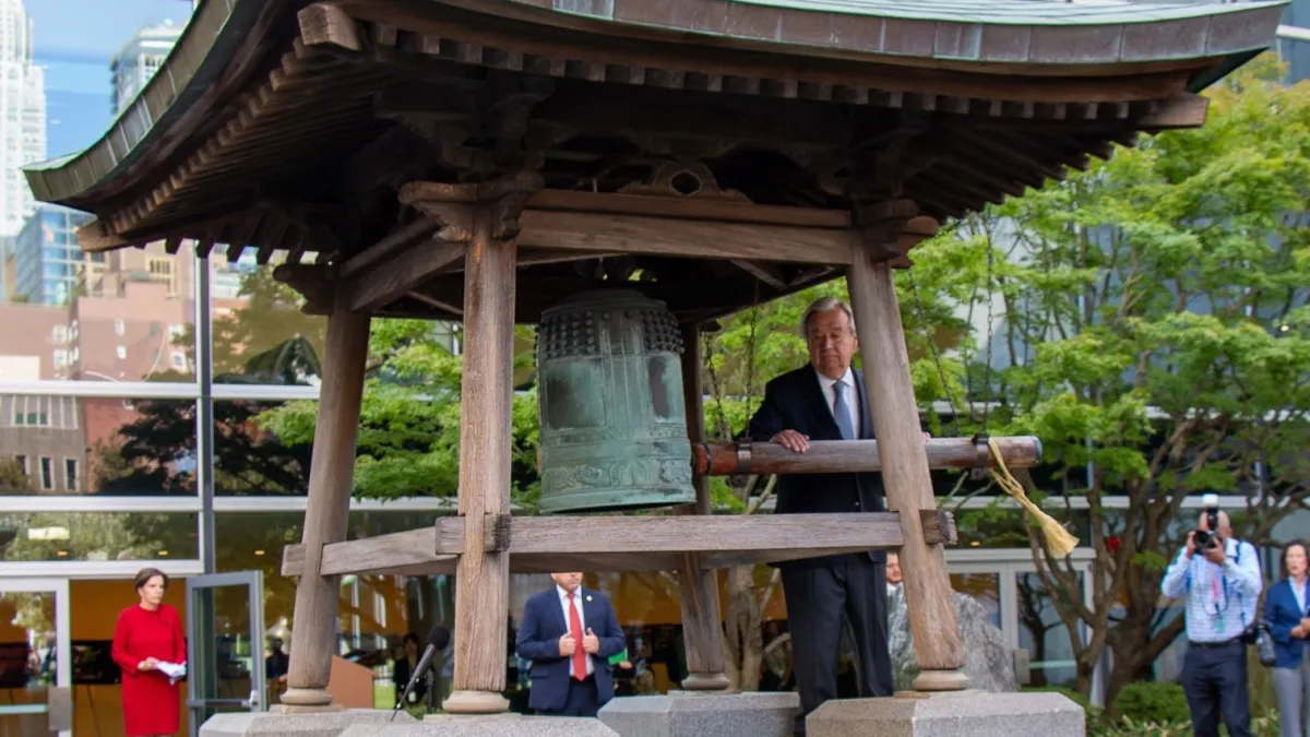 UN Secretary-General António Guterres rings the Peace Bell at United Nations Headquarters in New York