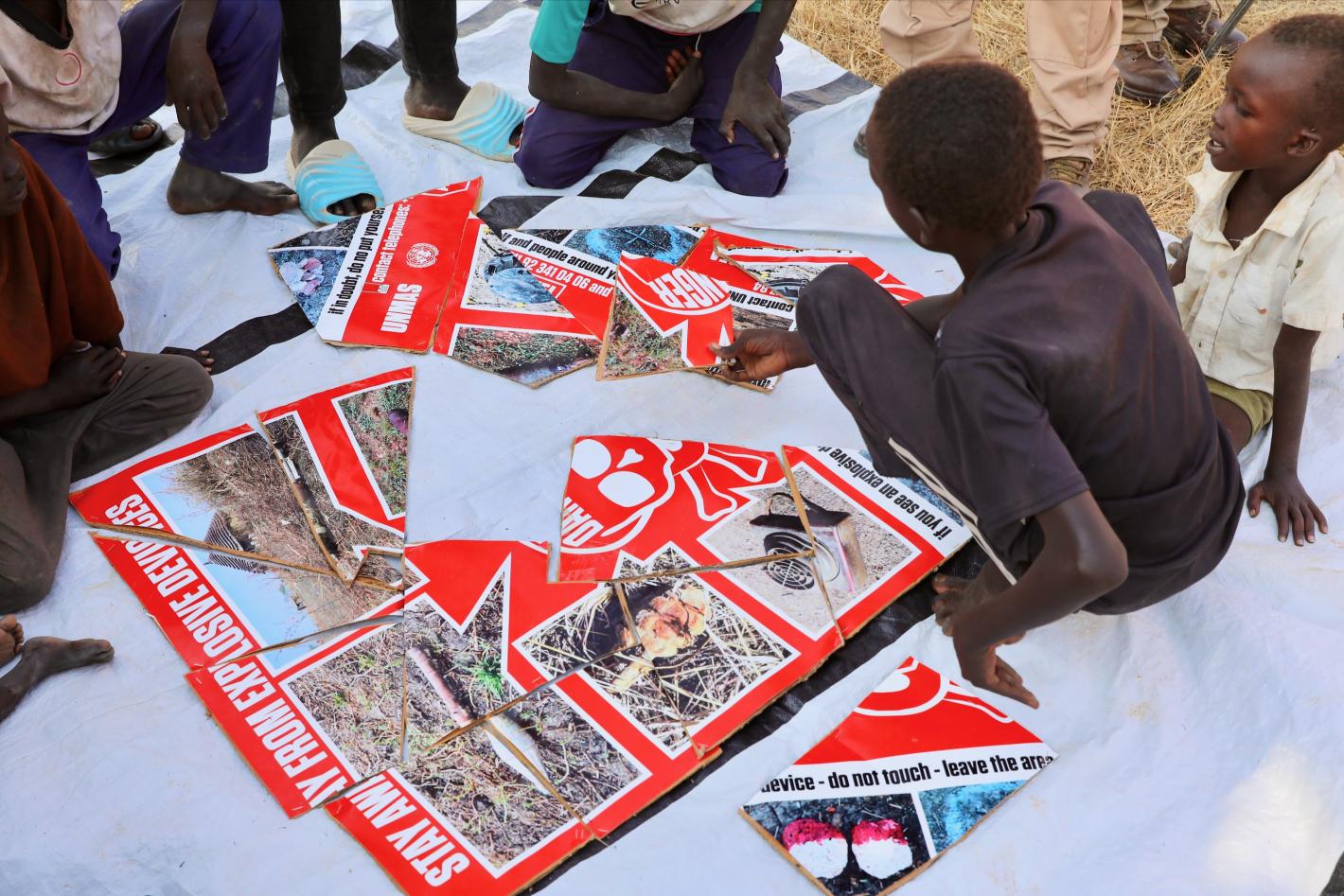 a child is piecing together a puzzle