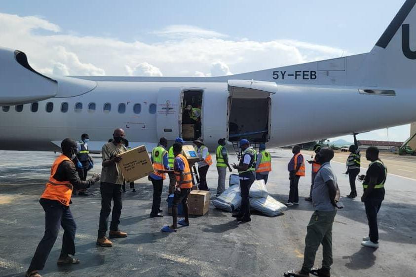 Staff from the mission and WHO receiving equipment at airport