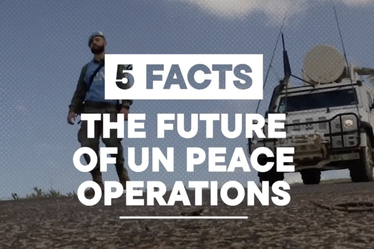 Video cover one peacekeeper walking ahead of a vehicle.