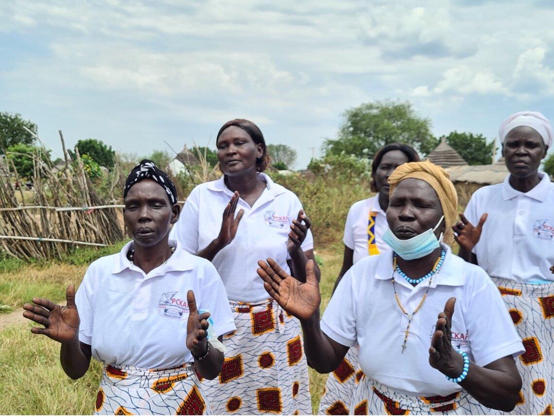 Atoch and women from the local community sharing dances and songs during a celebration. Photo courtesy: UNISFA