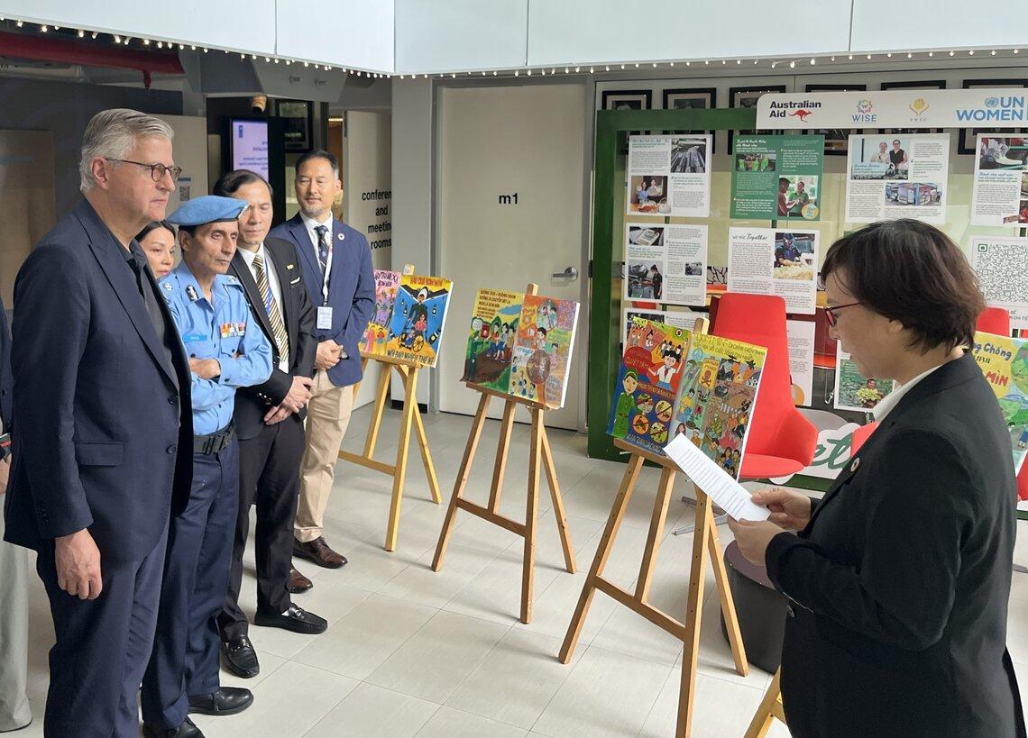 Mr. Lacroix visits the exhibition organized by UNDP Viet Nam and Viet Nam National Mine Action Center. Photo: UN